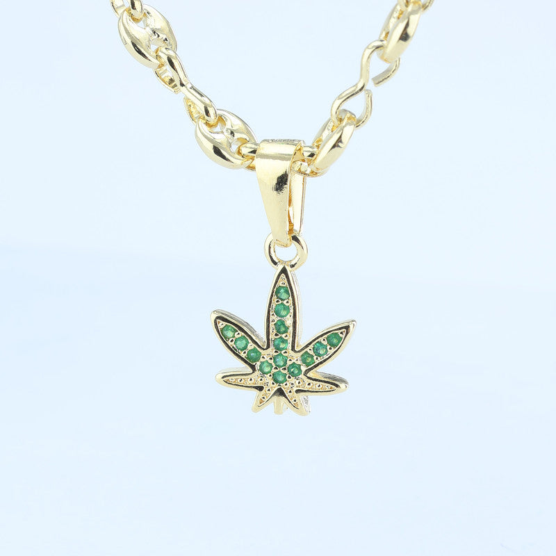DIJE HOJA ANNABIS ZIRCONES ESMERALDA 18*100MM 706837